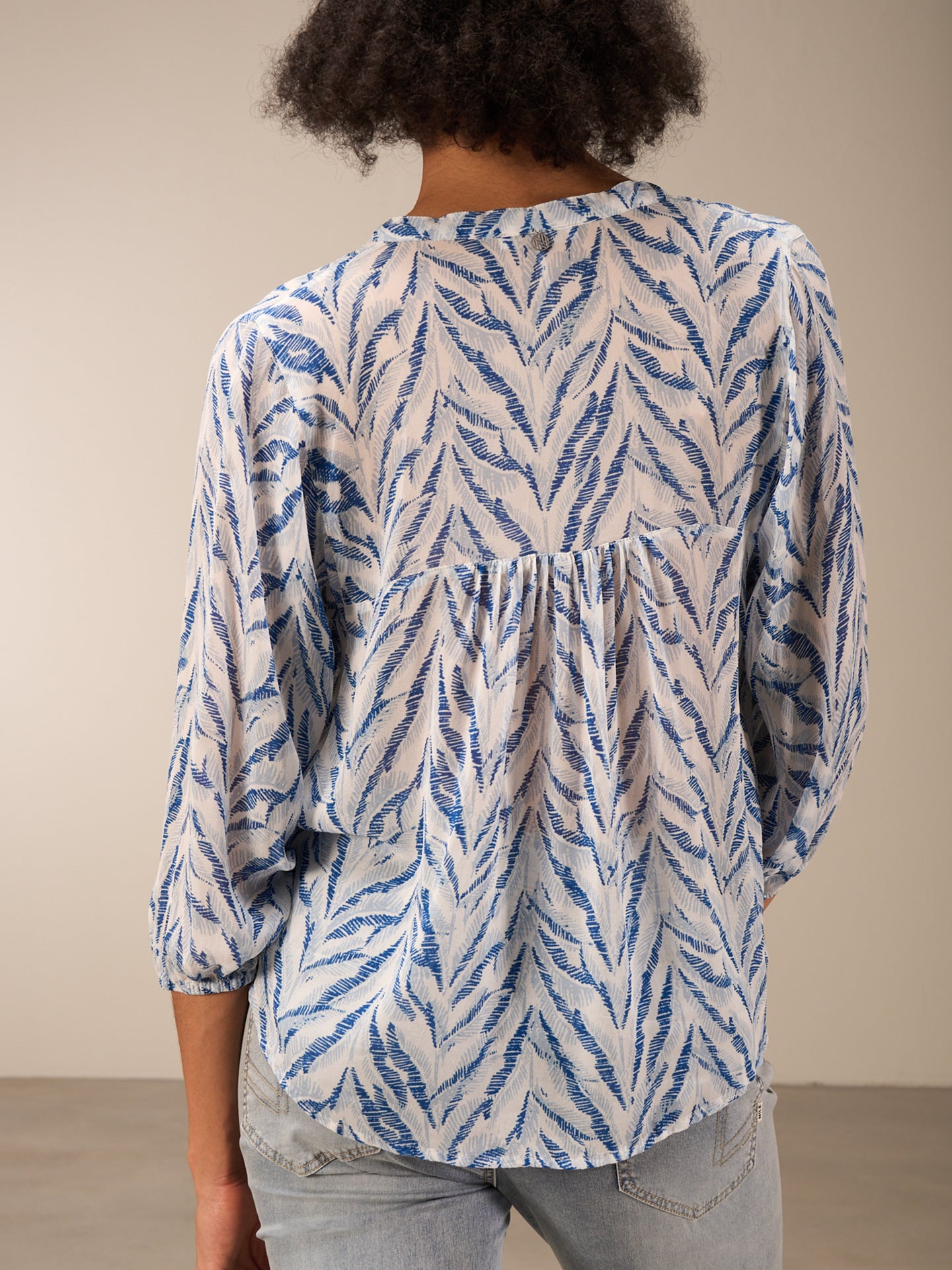 Blouse with flounce