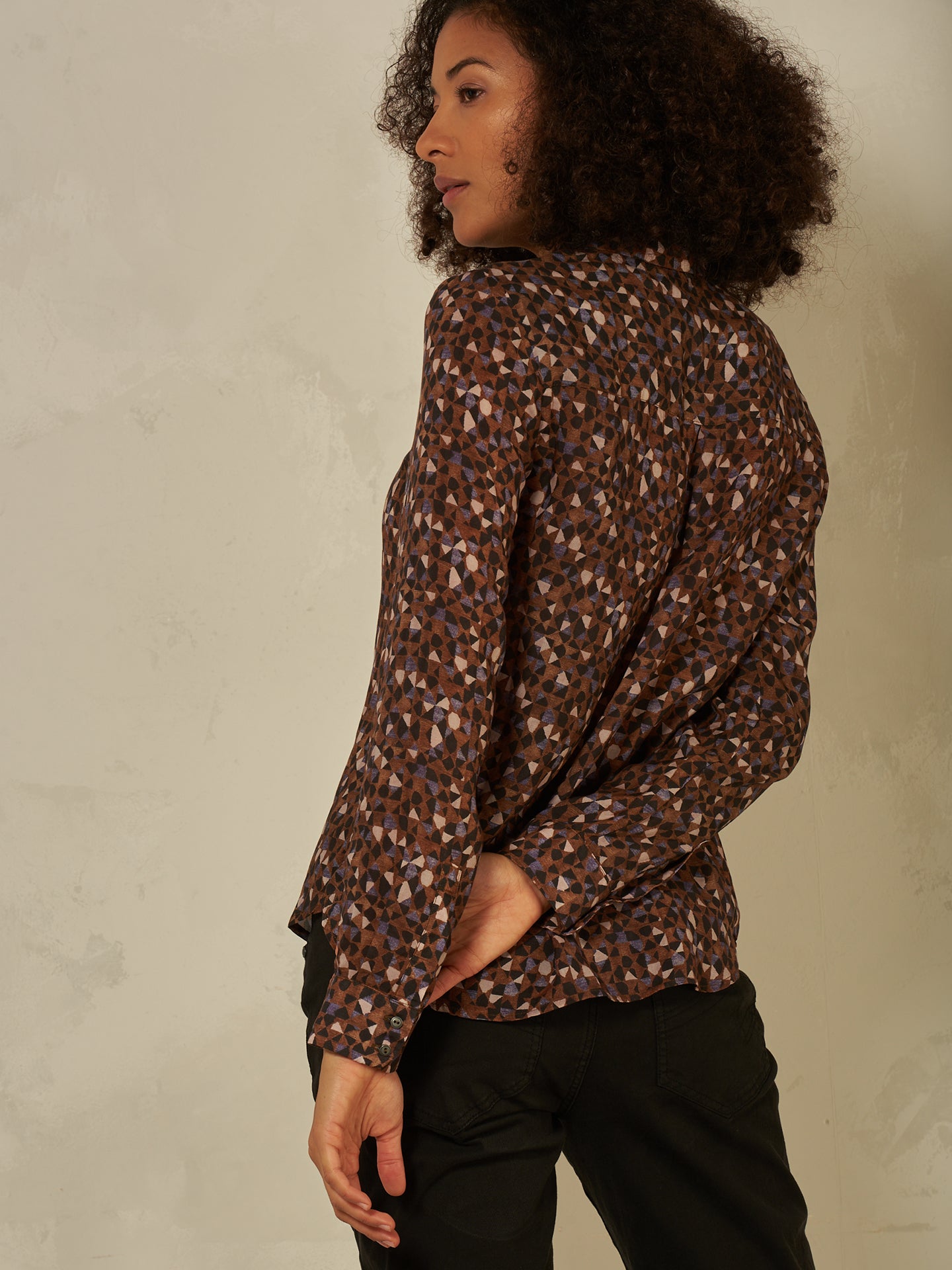 Blusa con abbottonatura