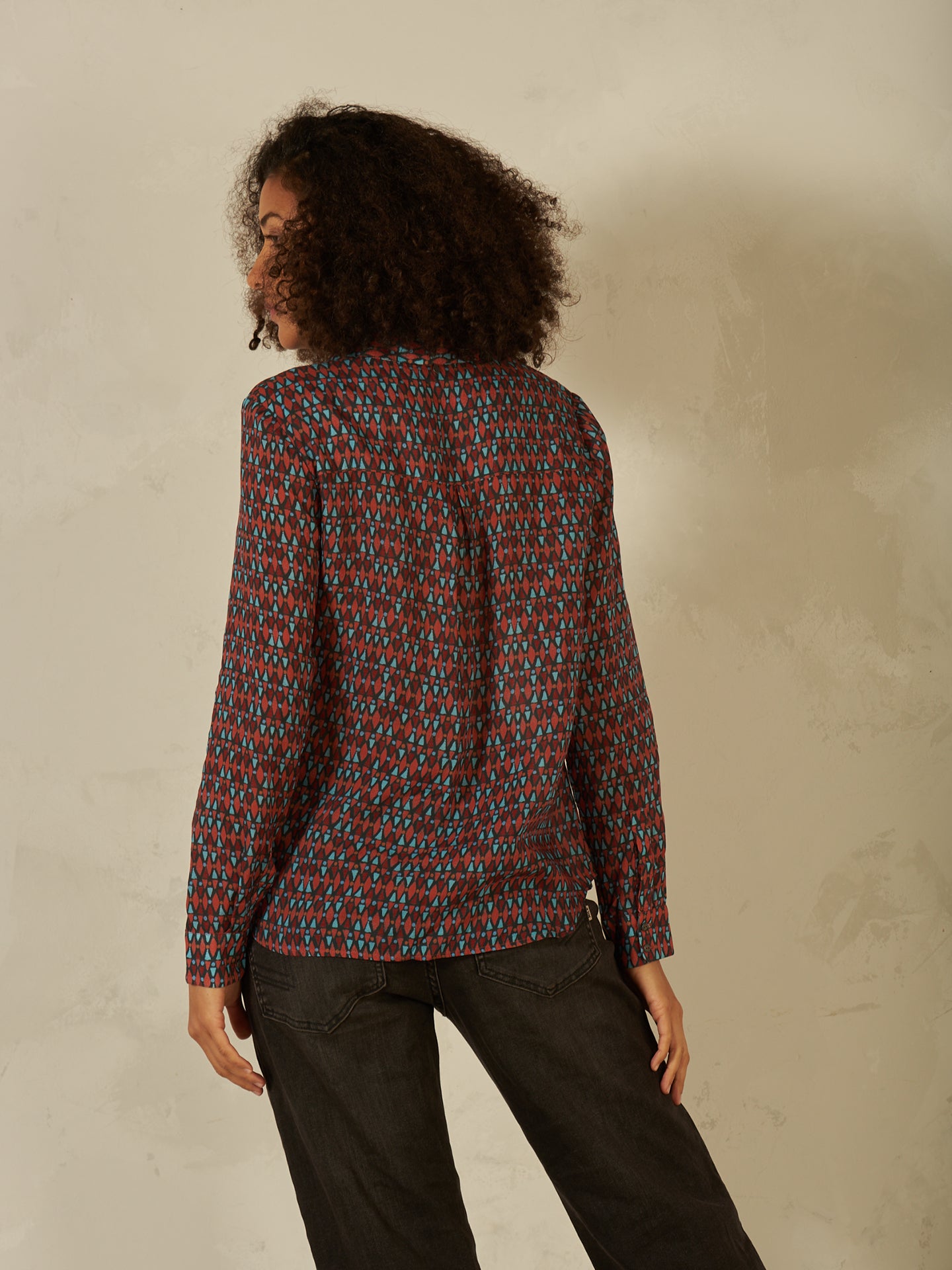 Blusa con abbottonatura