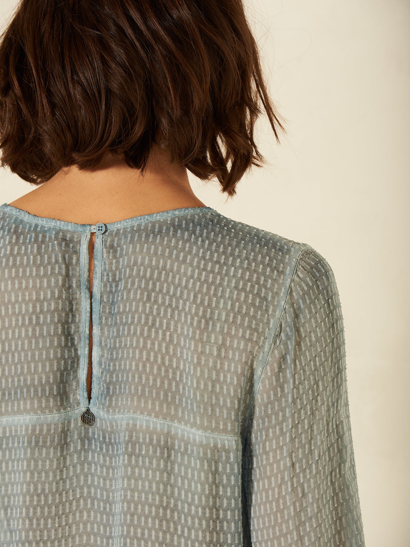 Blusa con dettaglio all’uncinetto