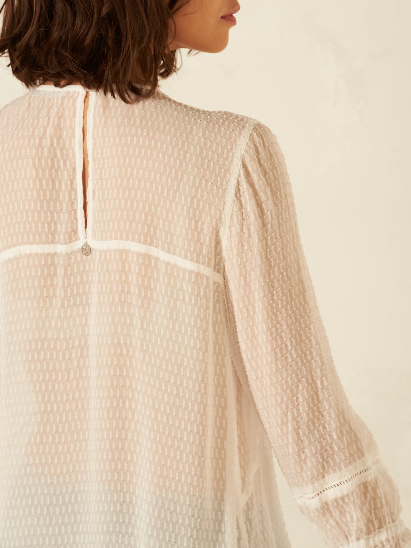 Blusa con dettaglio all’uncinetto