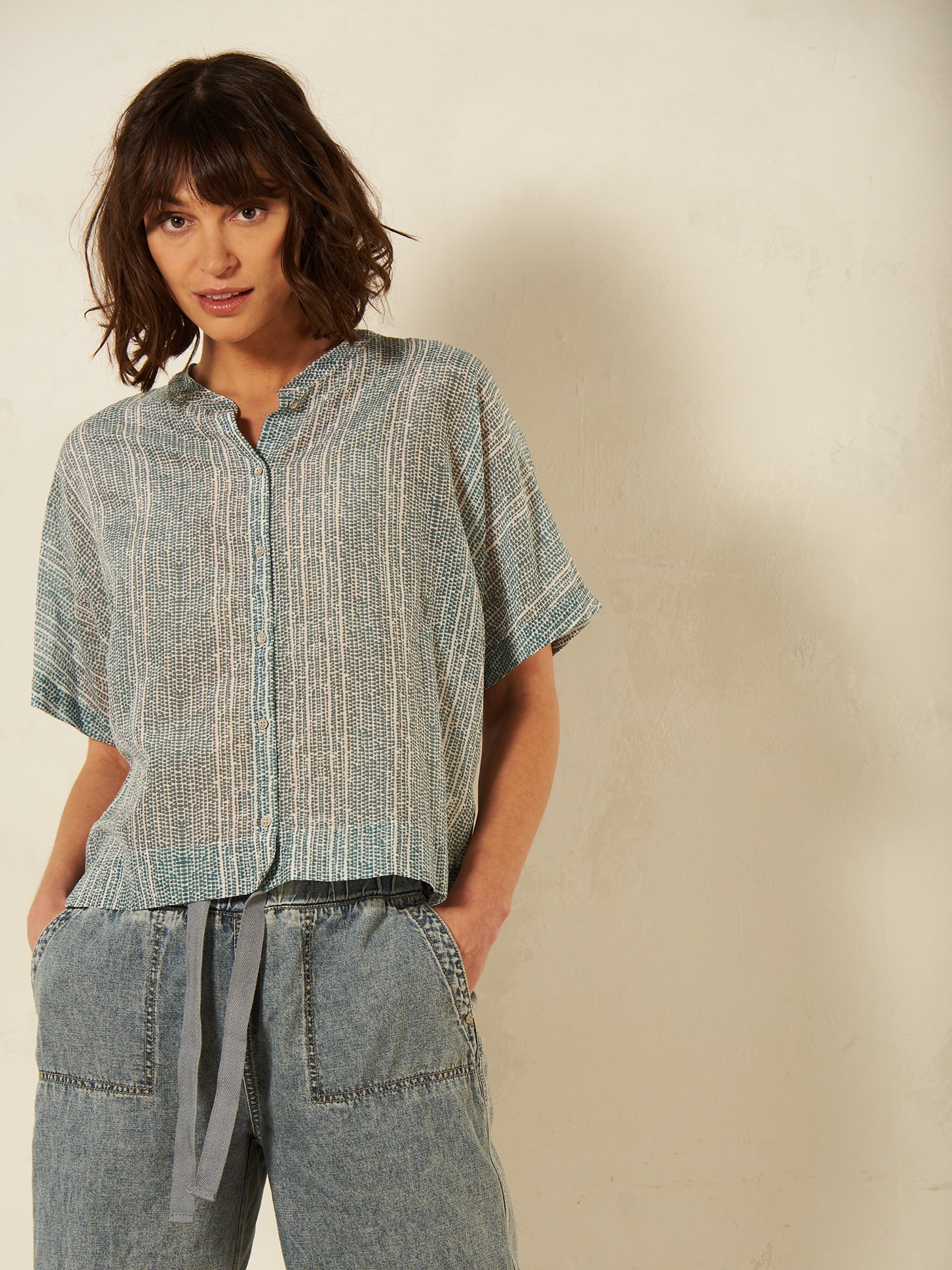 Blusa con abbottonatura