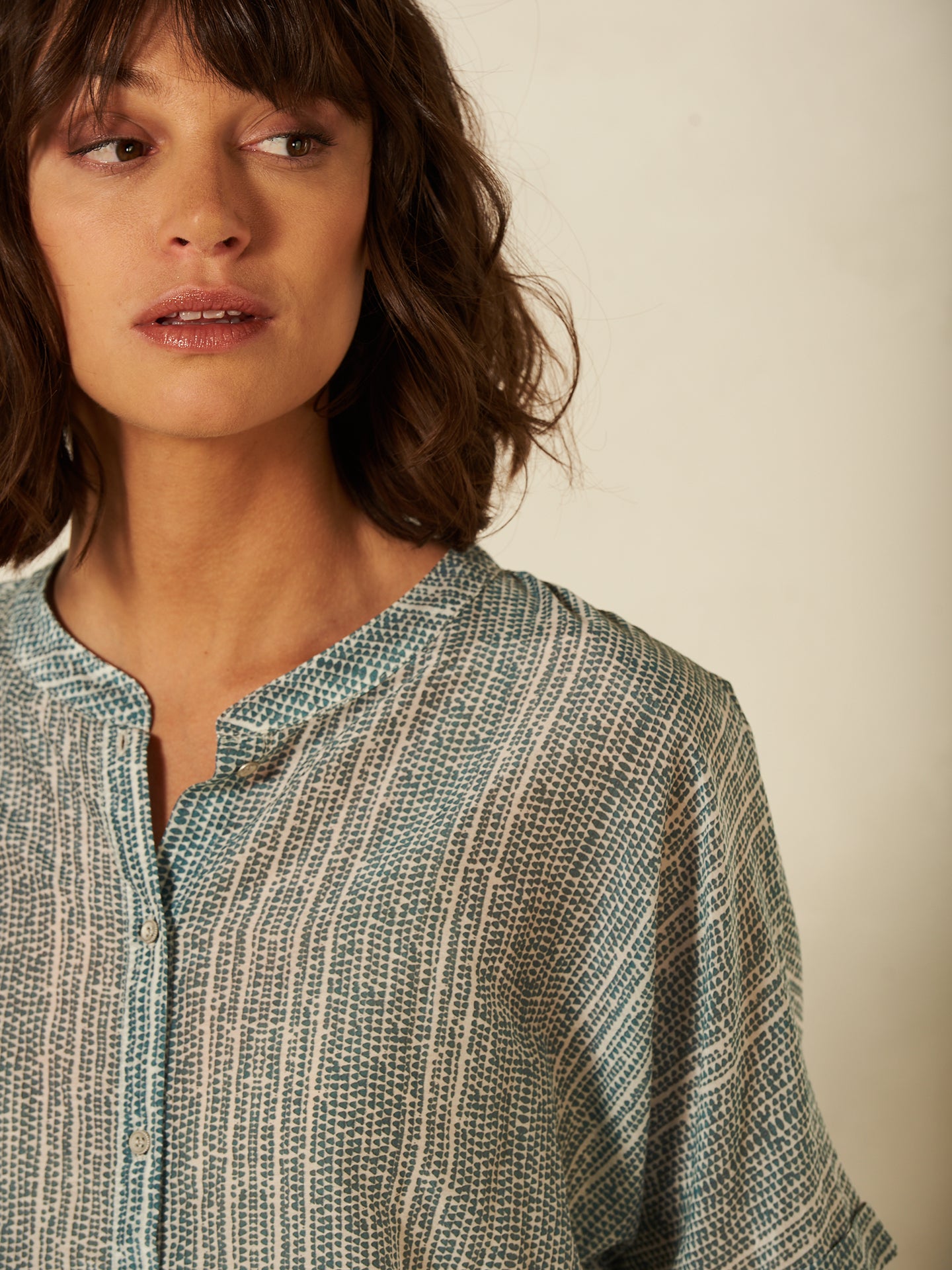 Blusa con abbottonatura