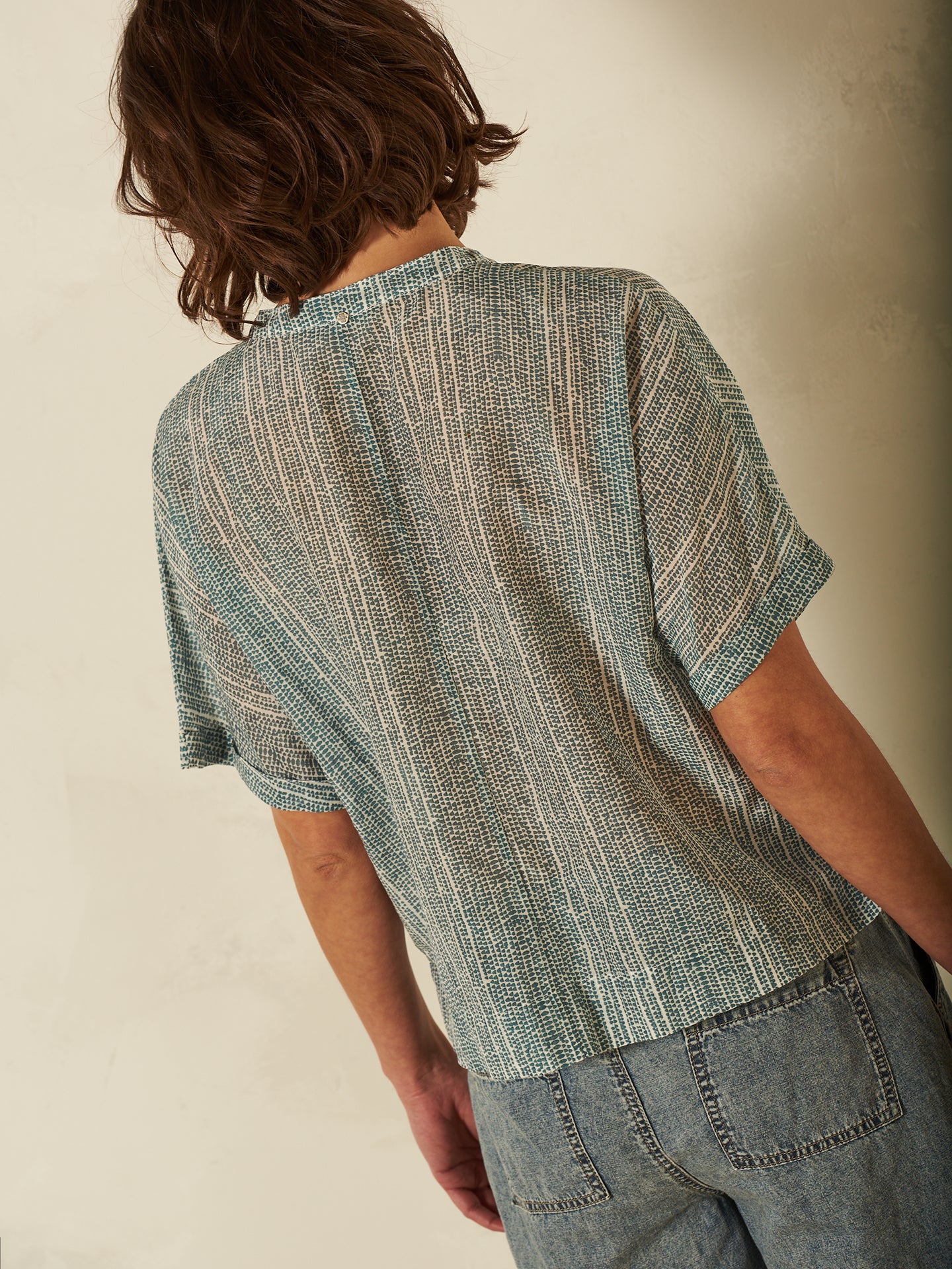 Blusa con abbottonatura