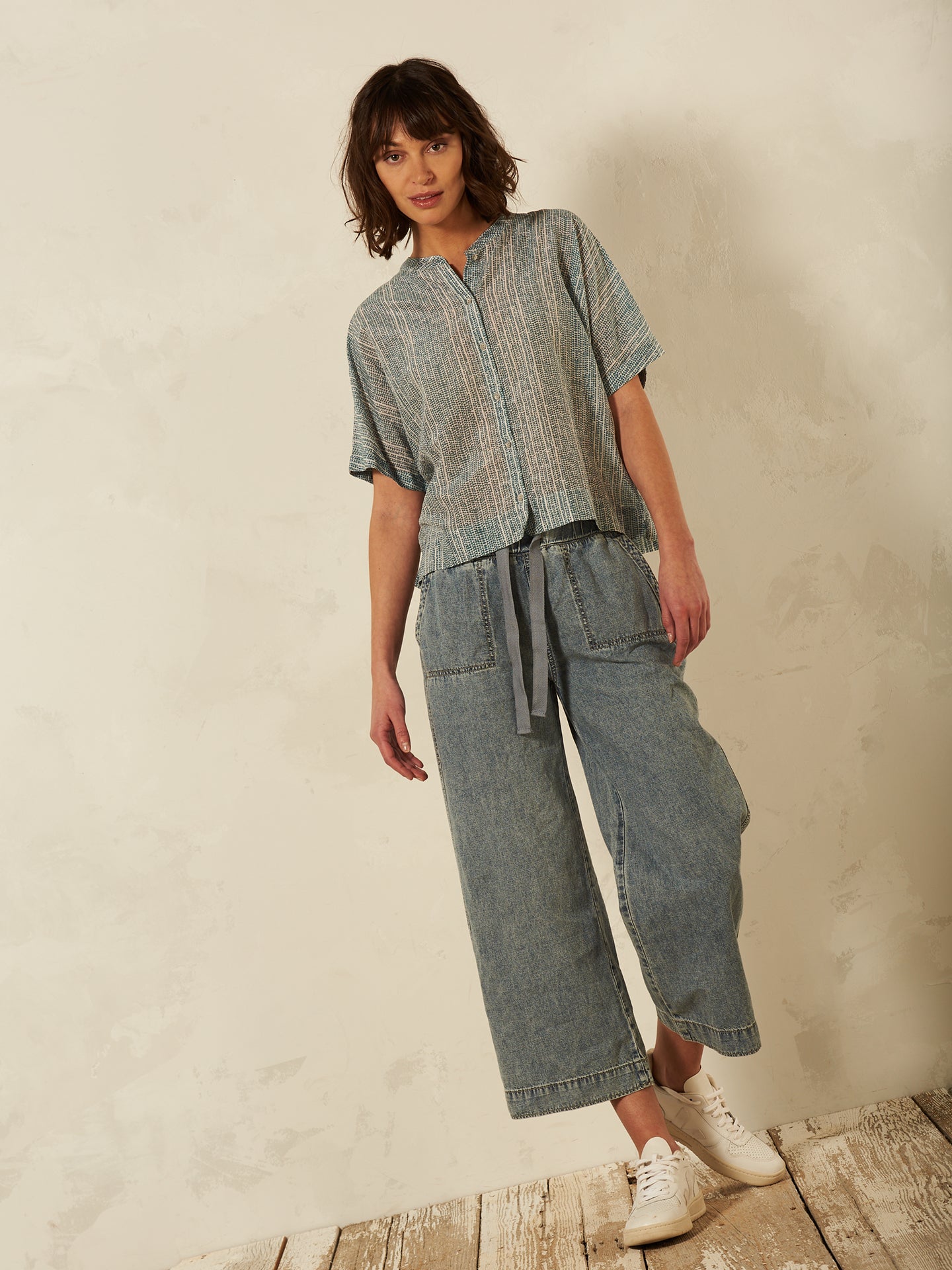 Blusa con abbottonatura