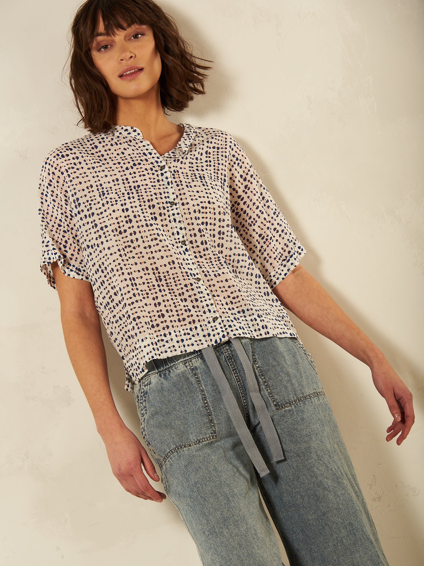 Blusa con abbottonatura