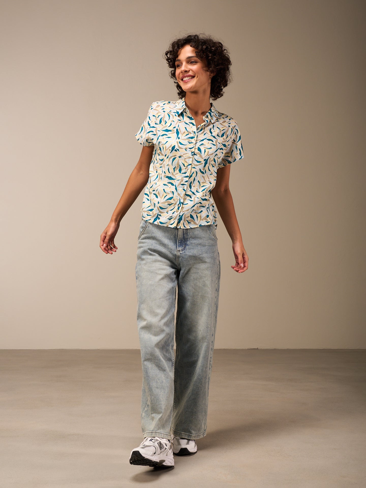 Blusa con abbottonatura