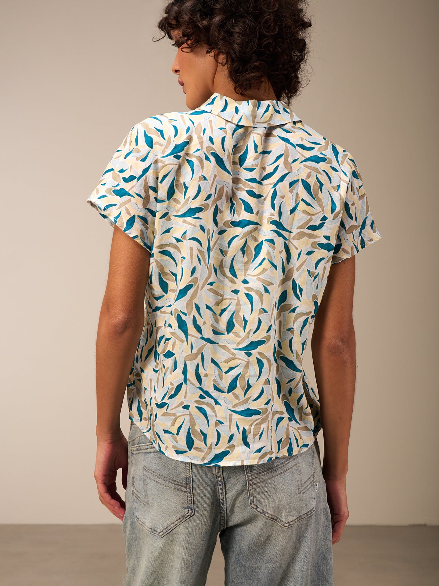 Blusa con abbottonatura