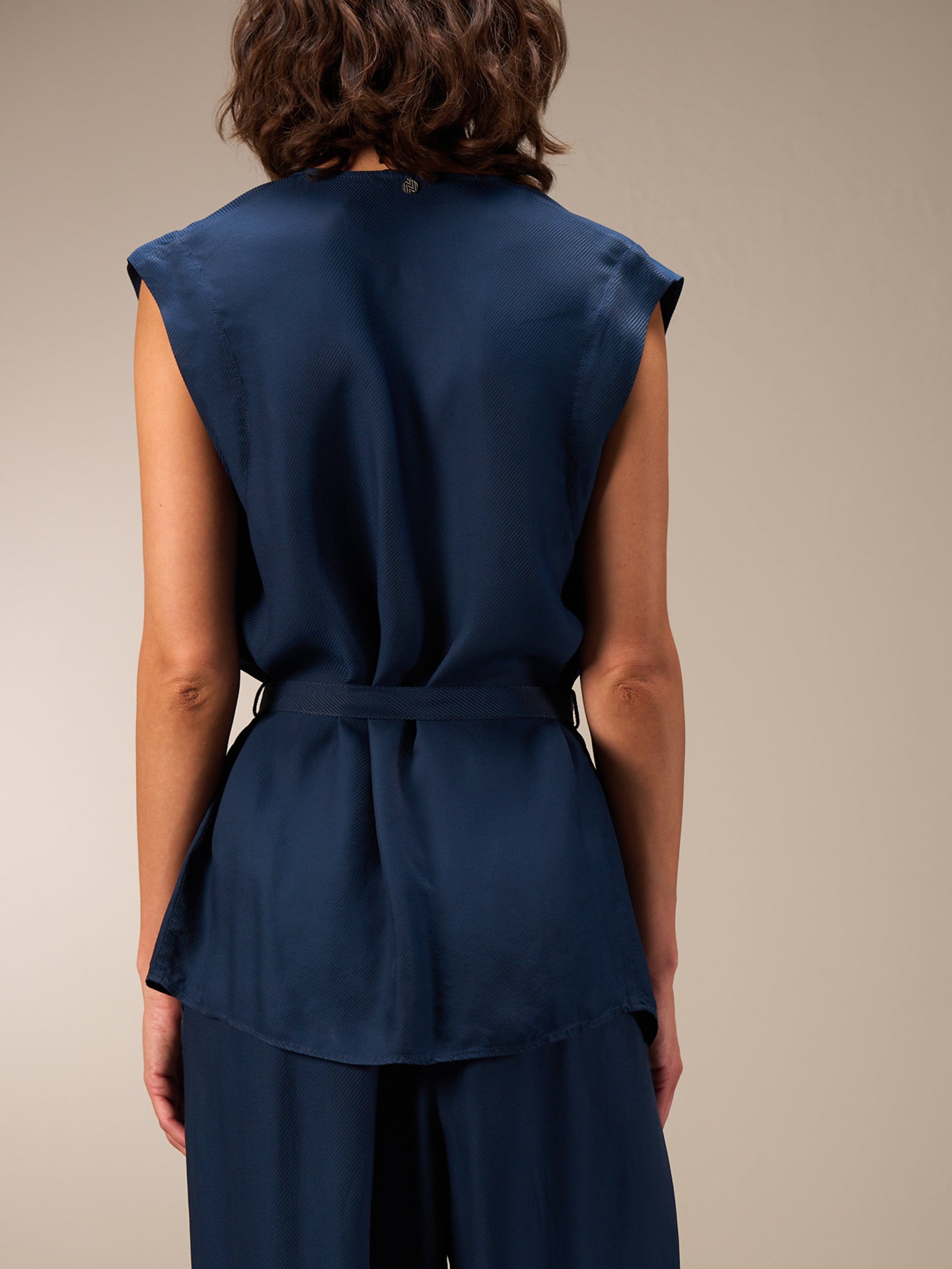 Vest with belt