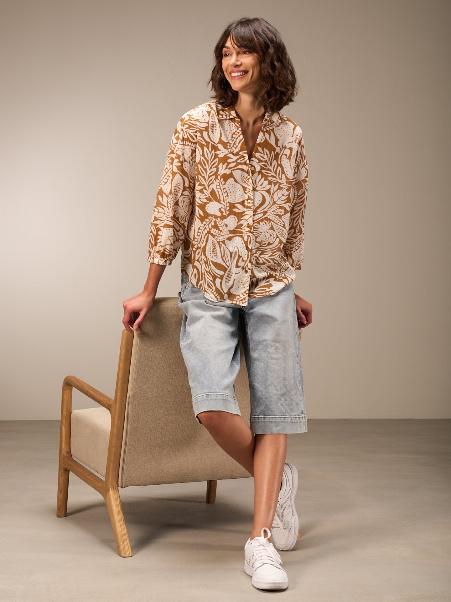 Blusa con abbottonatura