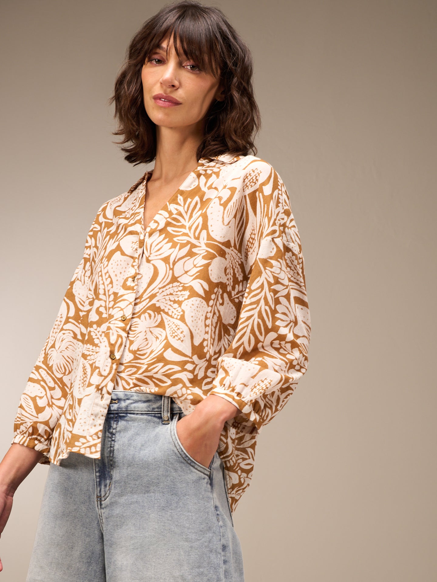 Blusa con abbottonatura
