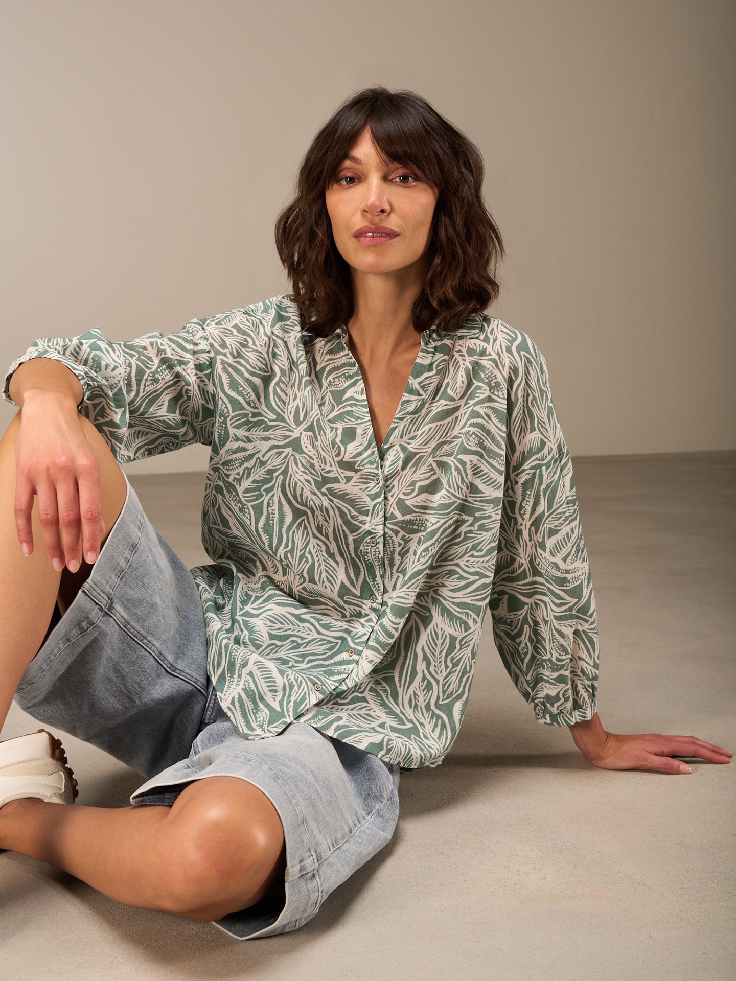Blusa con abbottonatura