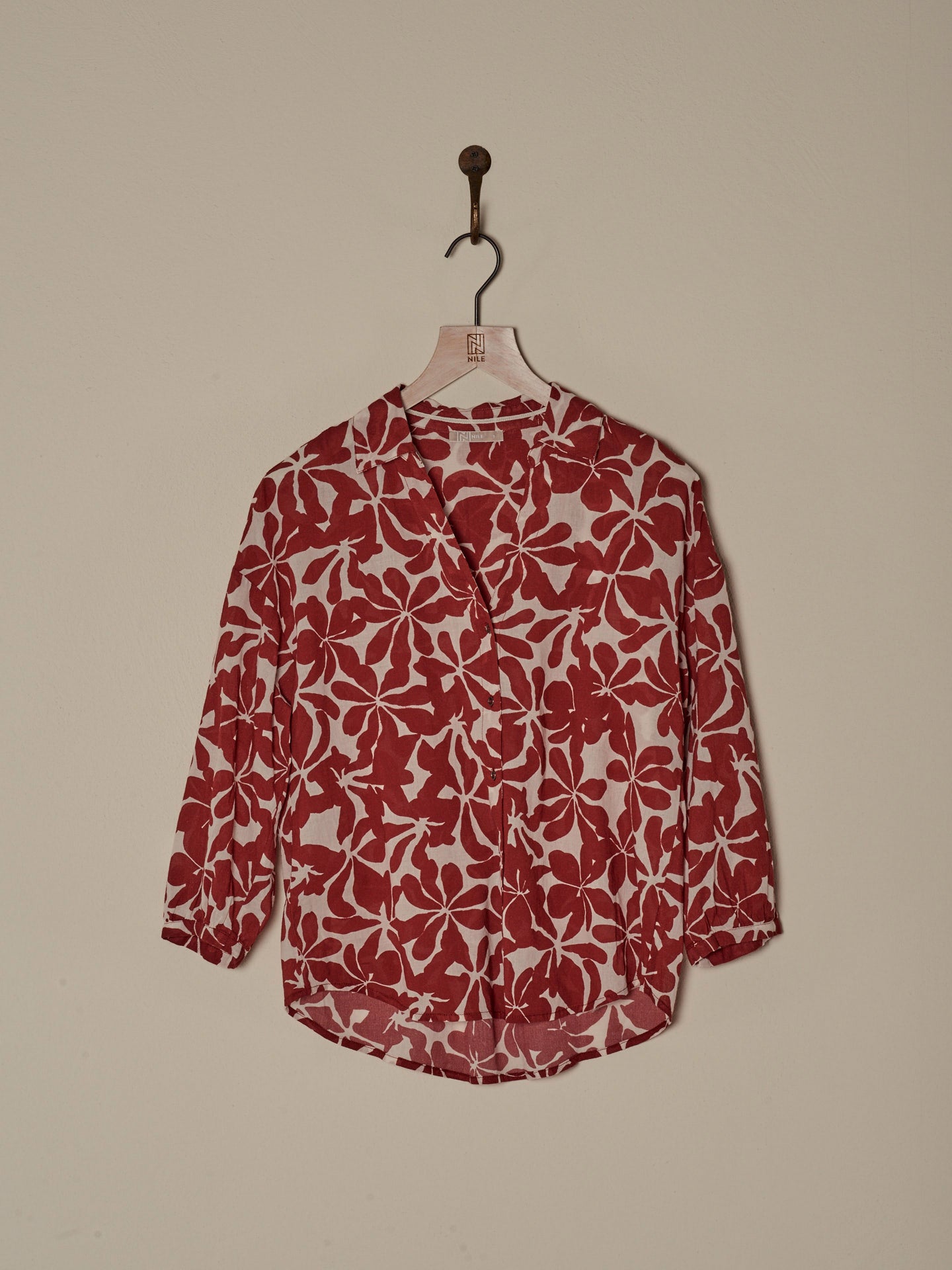Blusa con abbottonatura