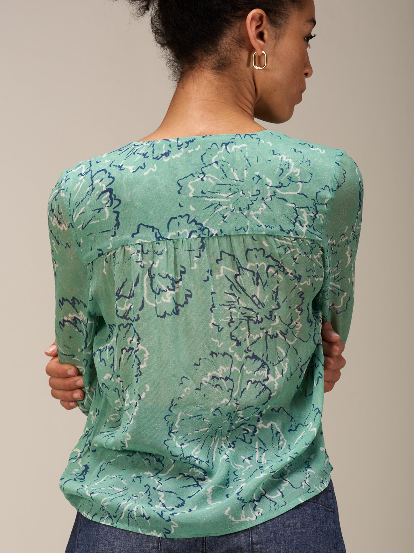 Blusa con abbottonatura