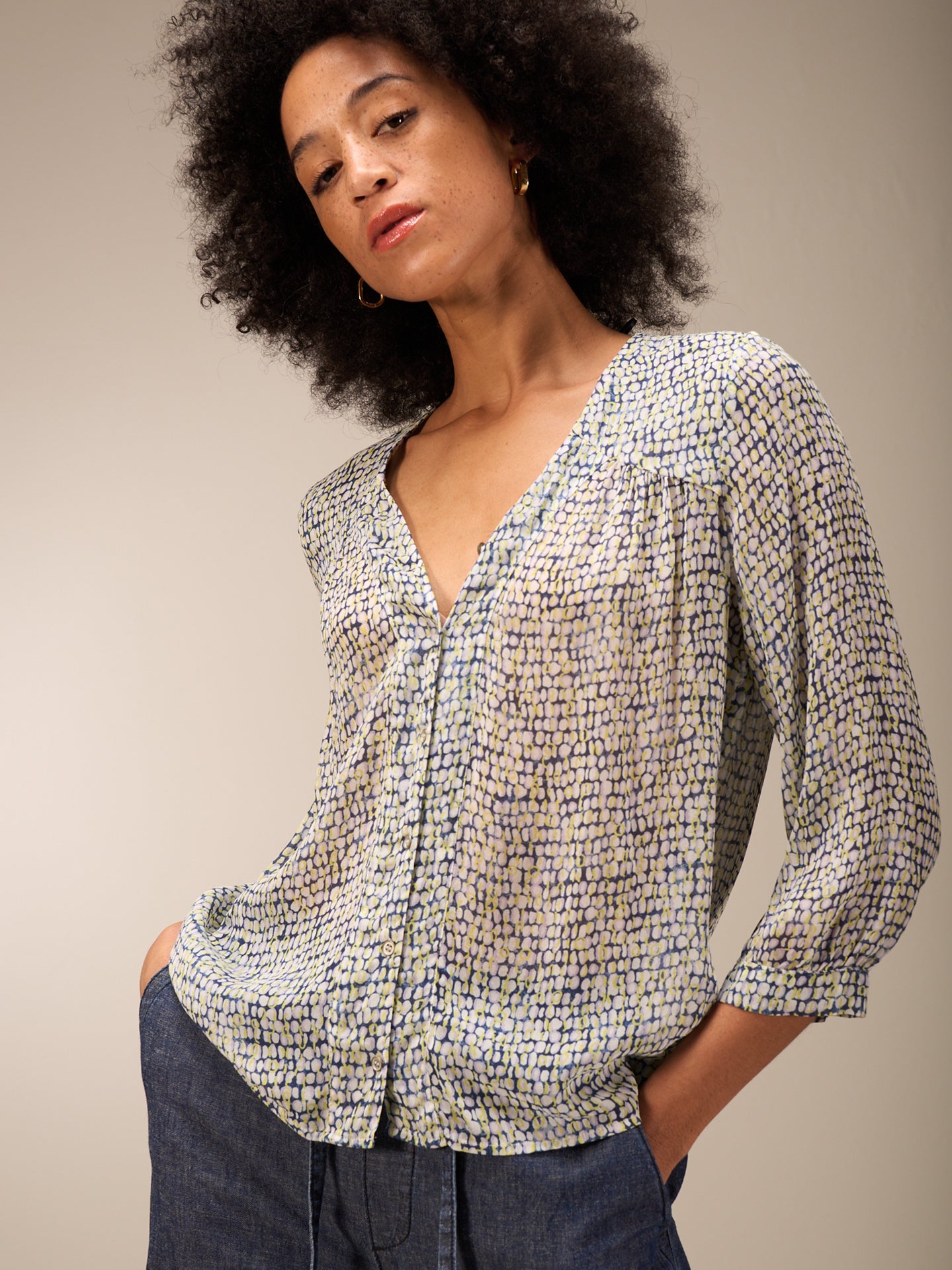 Blusa con abbottonatura