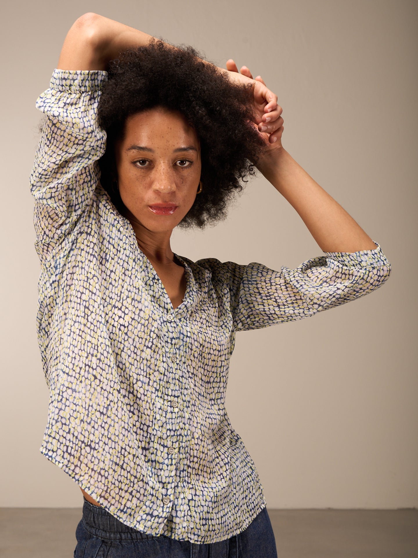 Blusa con abbottonatura