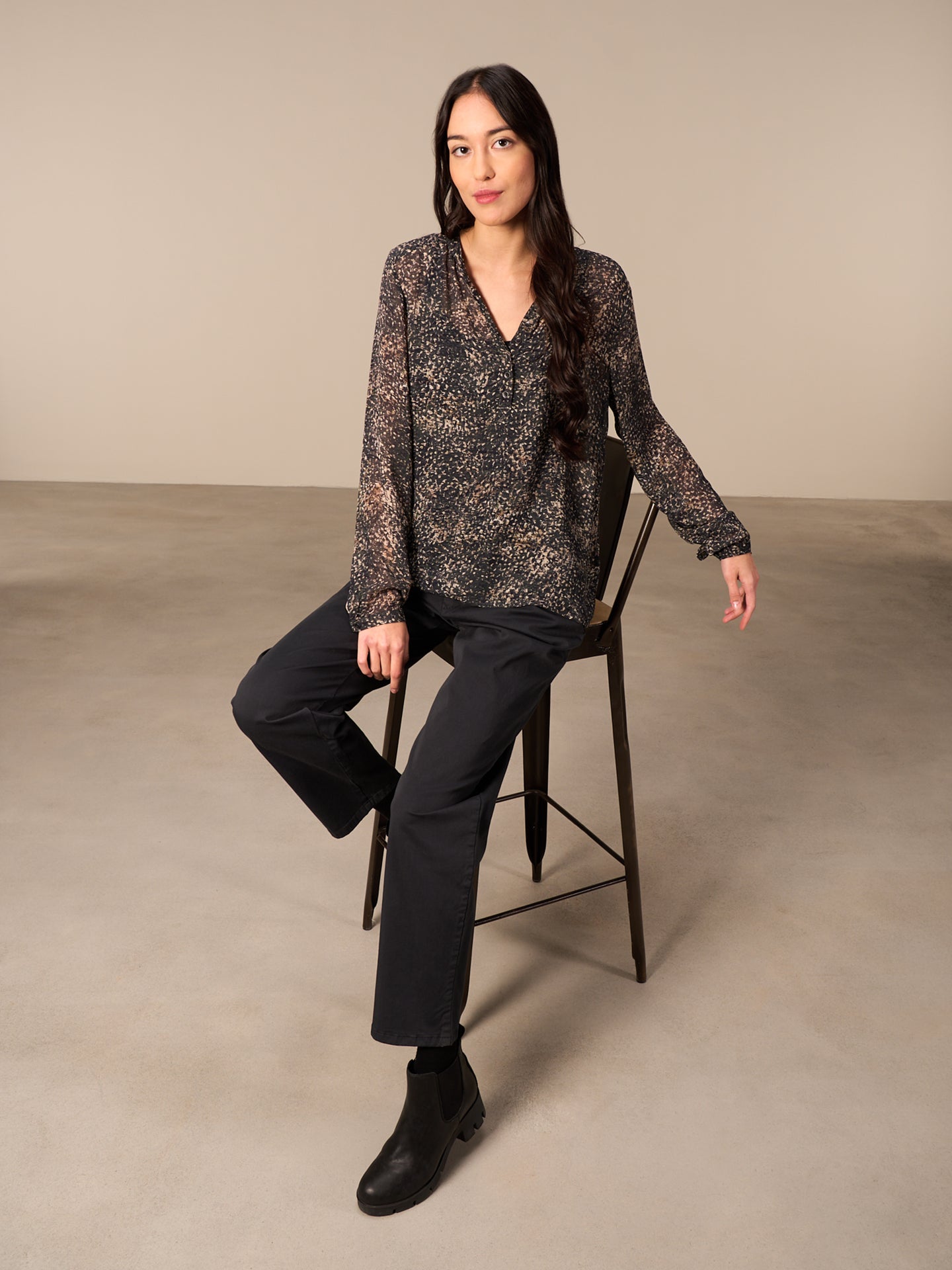 Blusa con abbottonatura