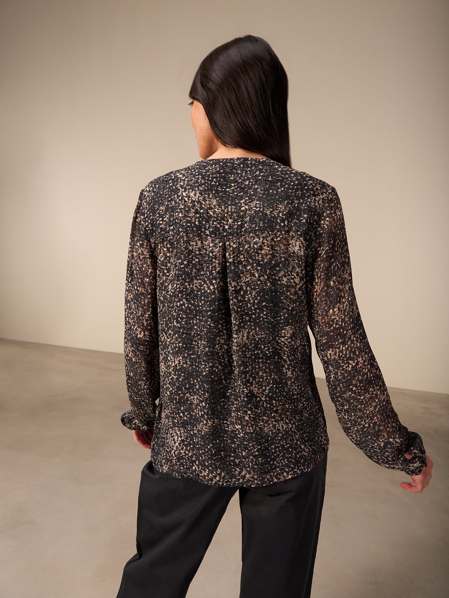 Blusa con abbottonatura