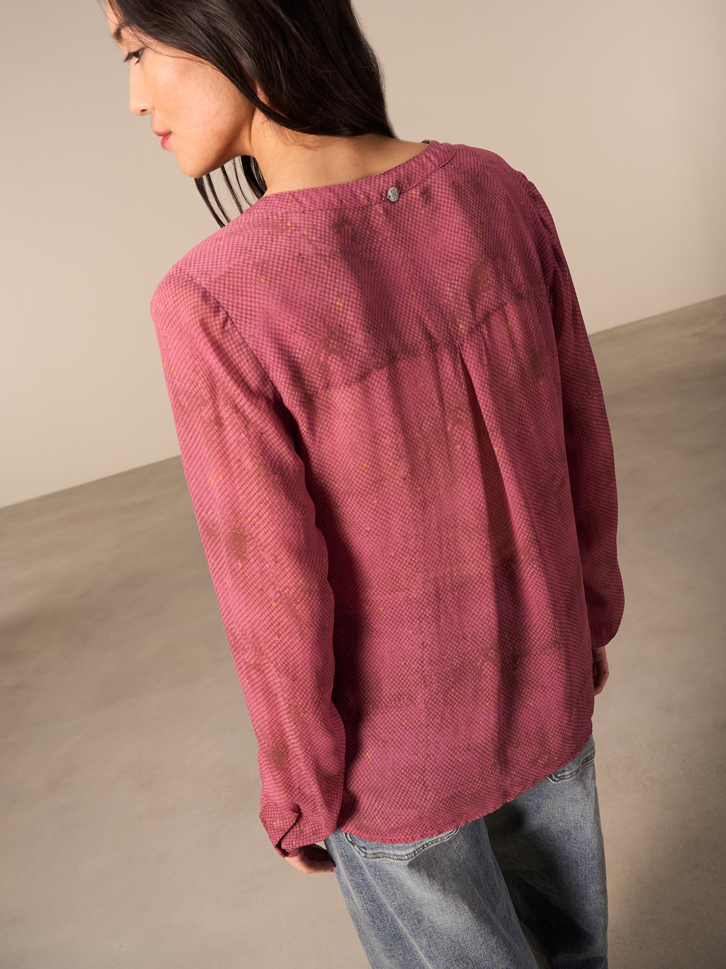 Blusa con abbottonatura