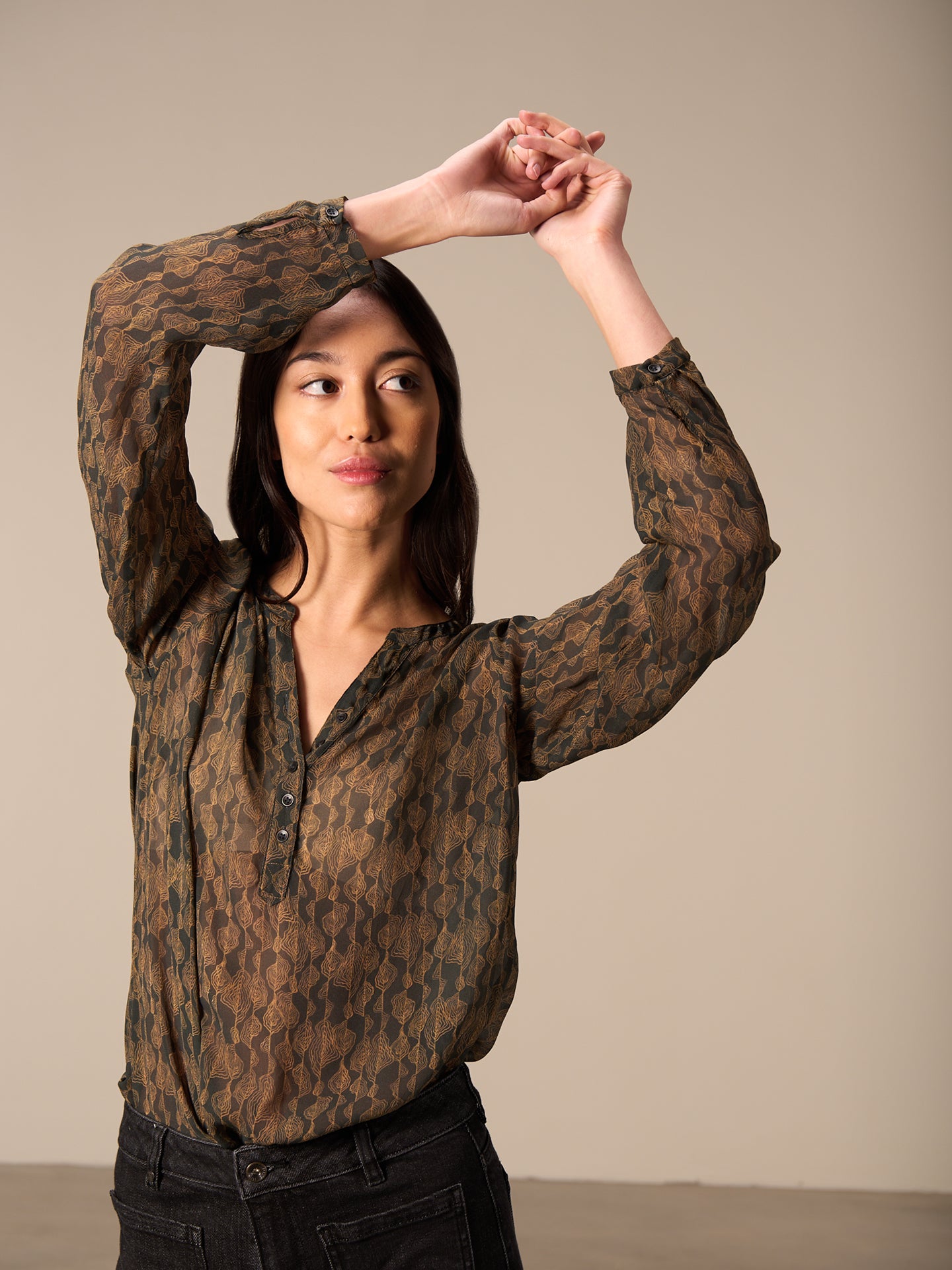 Blusa con abbottonatura