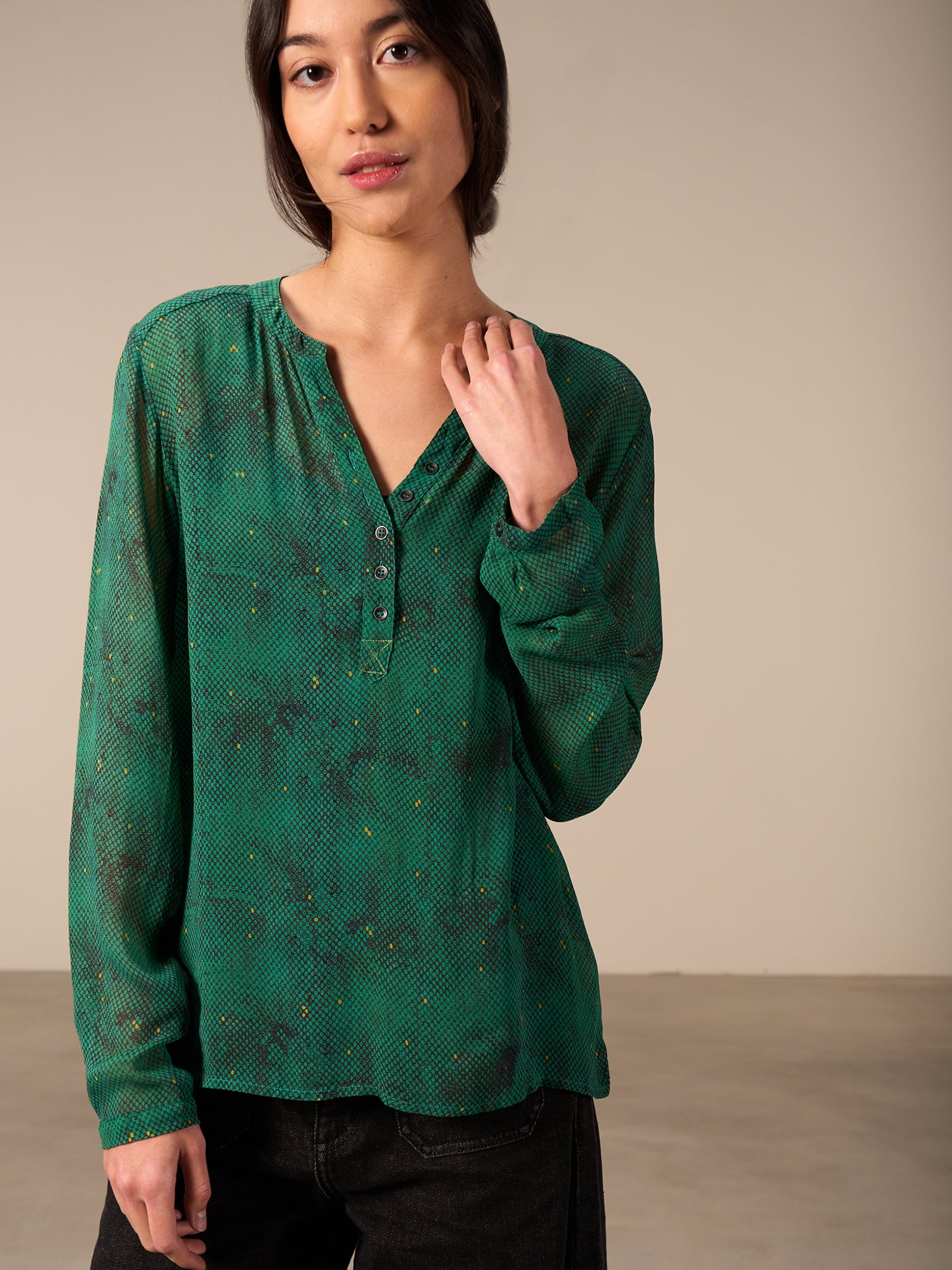 Blusa con abbottonatura