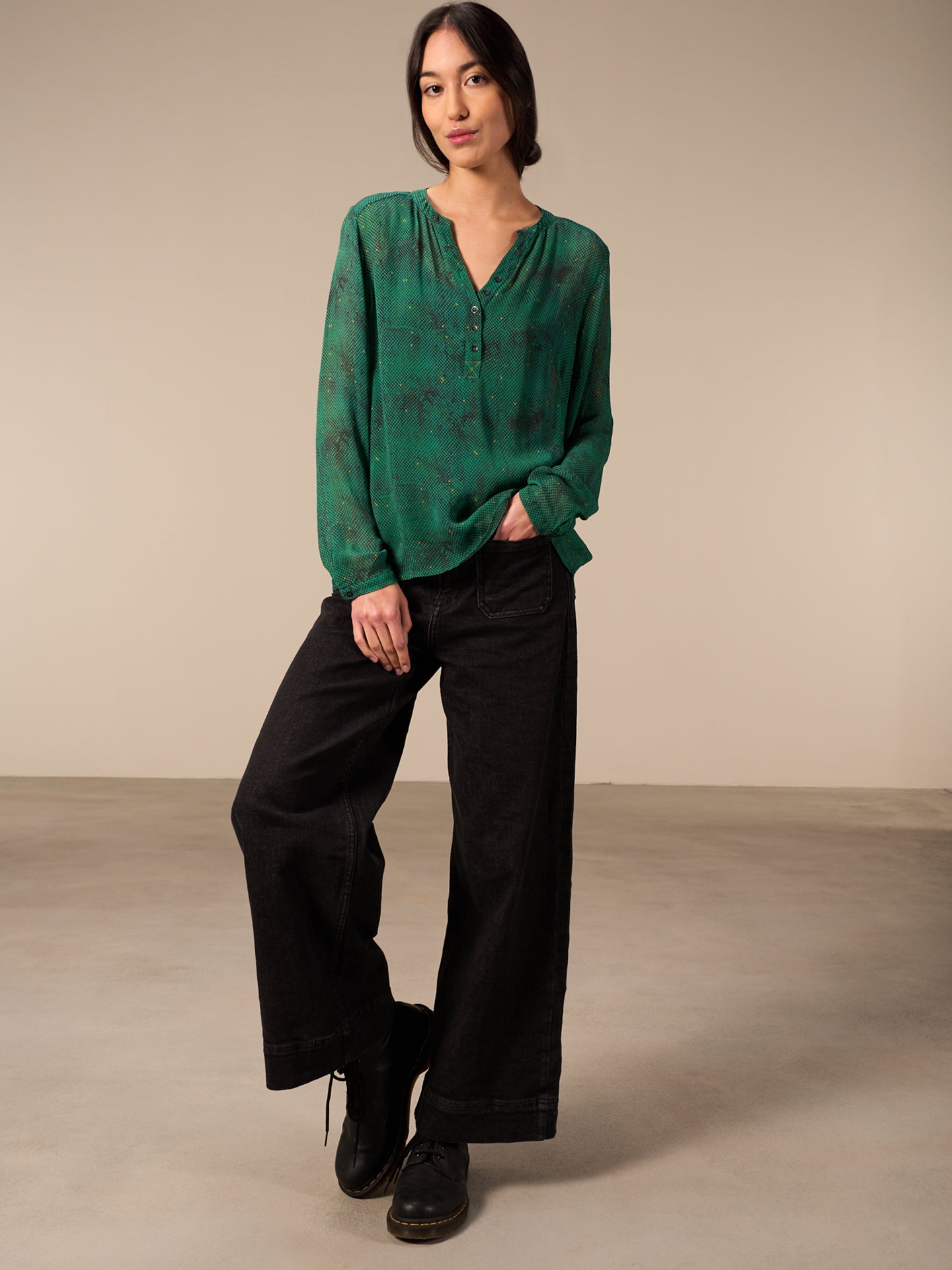 Blusa con abbottonatura