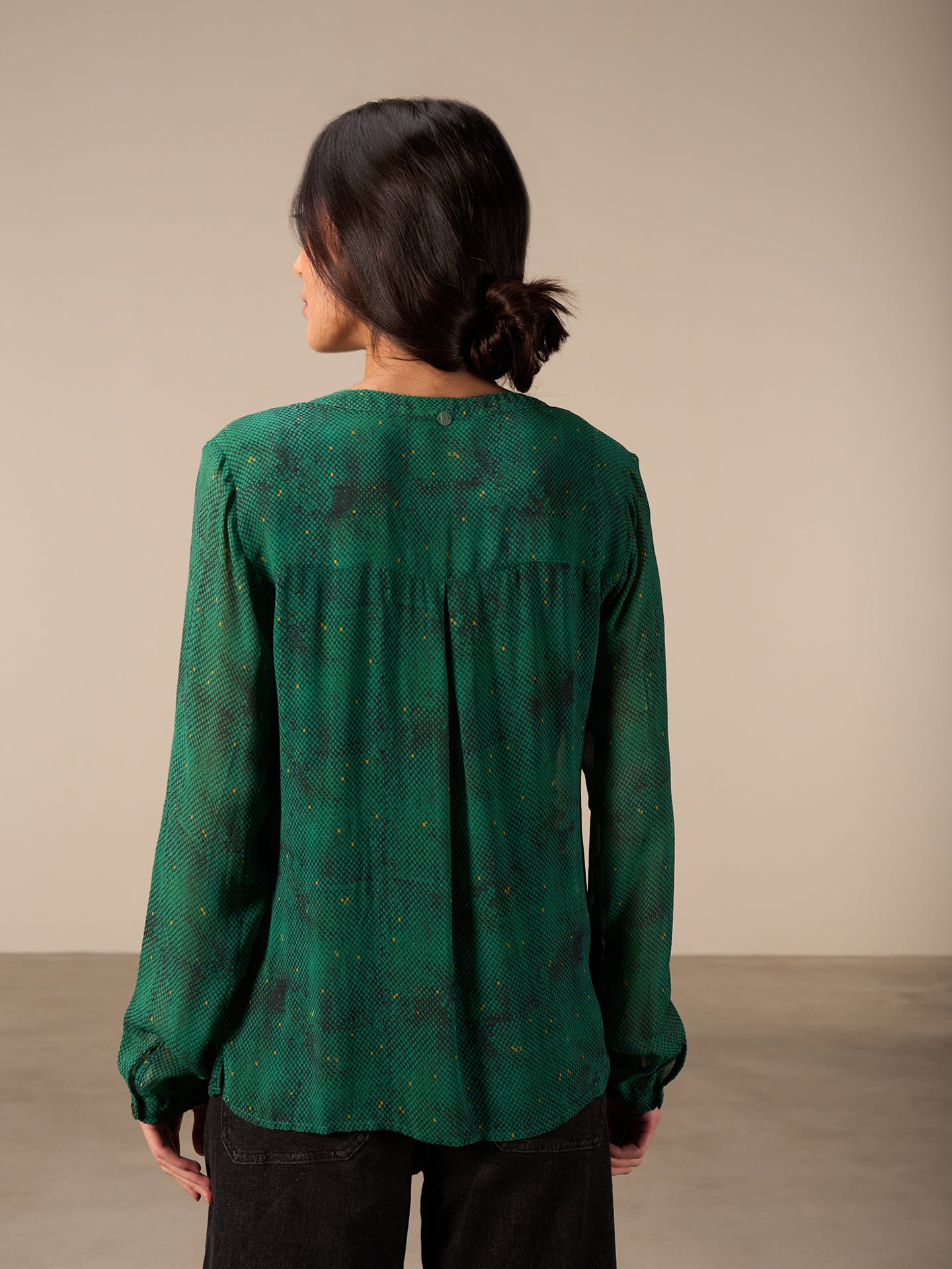 Blusa con abbottonatura